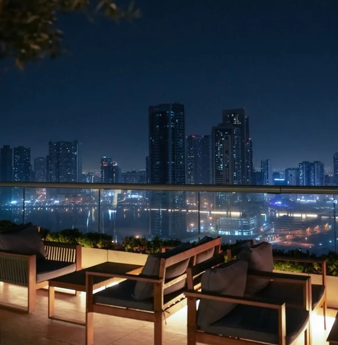 Baitna Cafe rooftop at night overlooking the Sharjah skyline